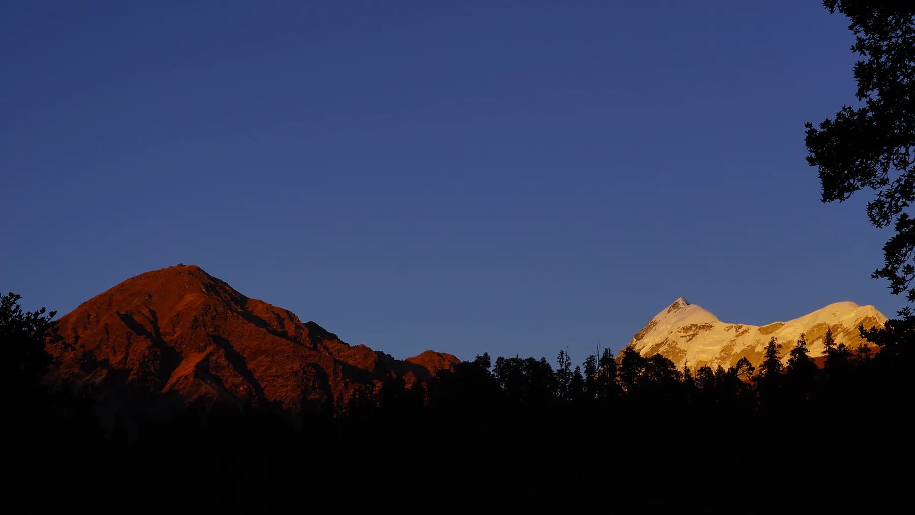 Trishul and surrounding ridges illuminated by golden morning light