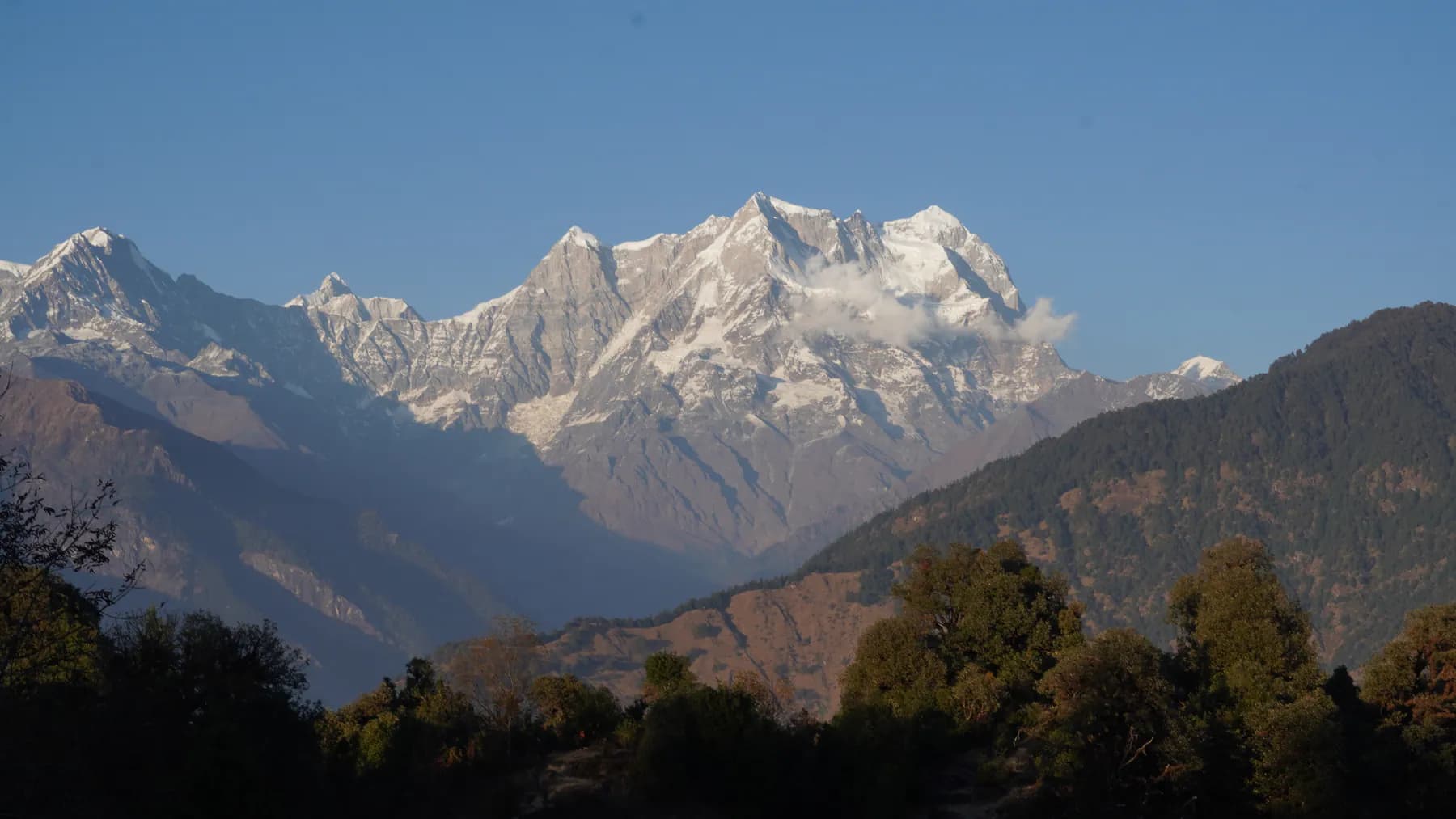 Clear morning view of the snow-covered Chaukhamba massif