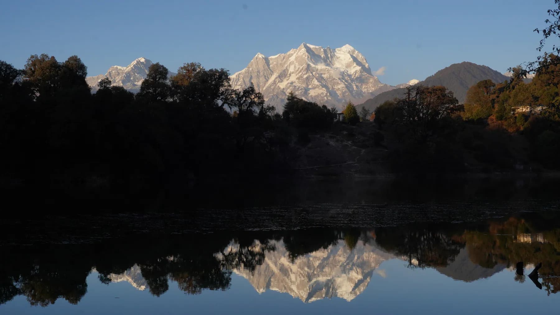 Golden morning light on Chaukhamba with its reflection in Deoriatal
