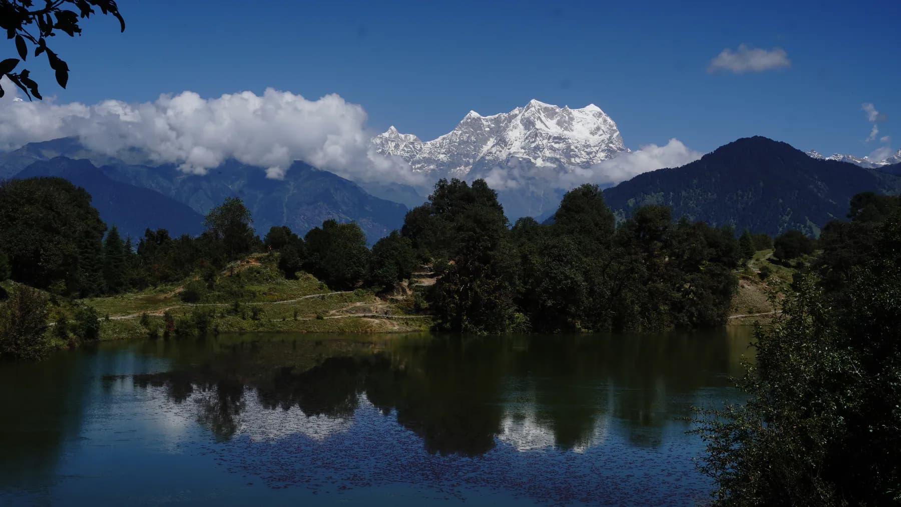 Chaukhamba massif rising above forest and Deoriatal lake