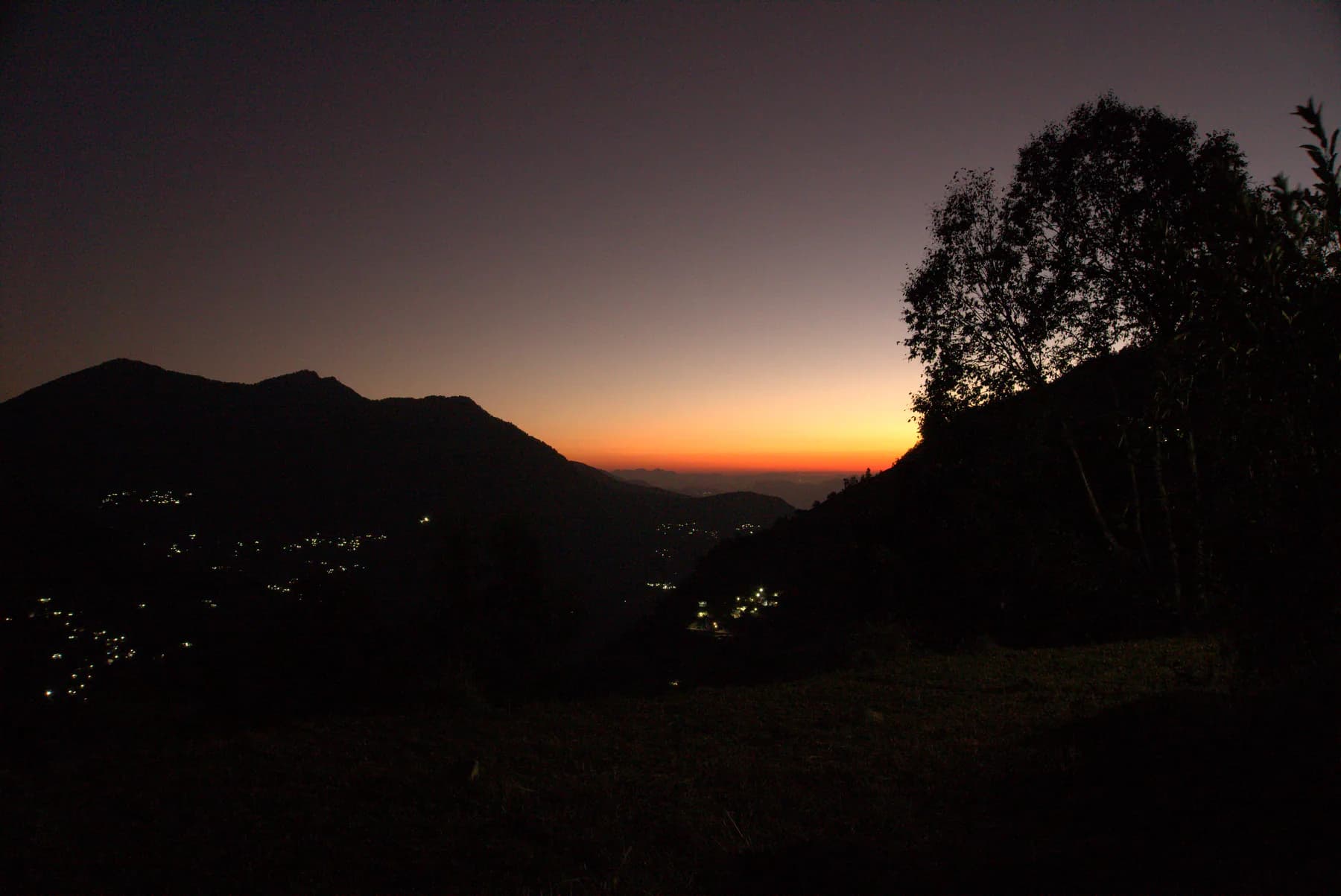 Twilight colours and village lights in the mountain valley near Sari