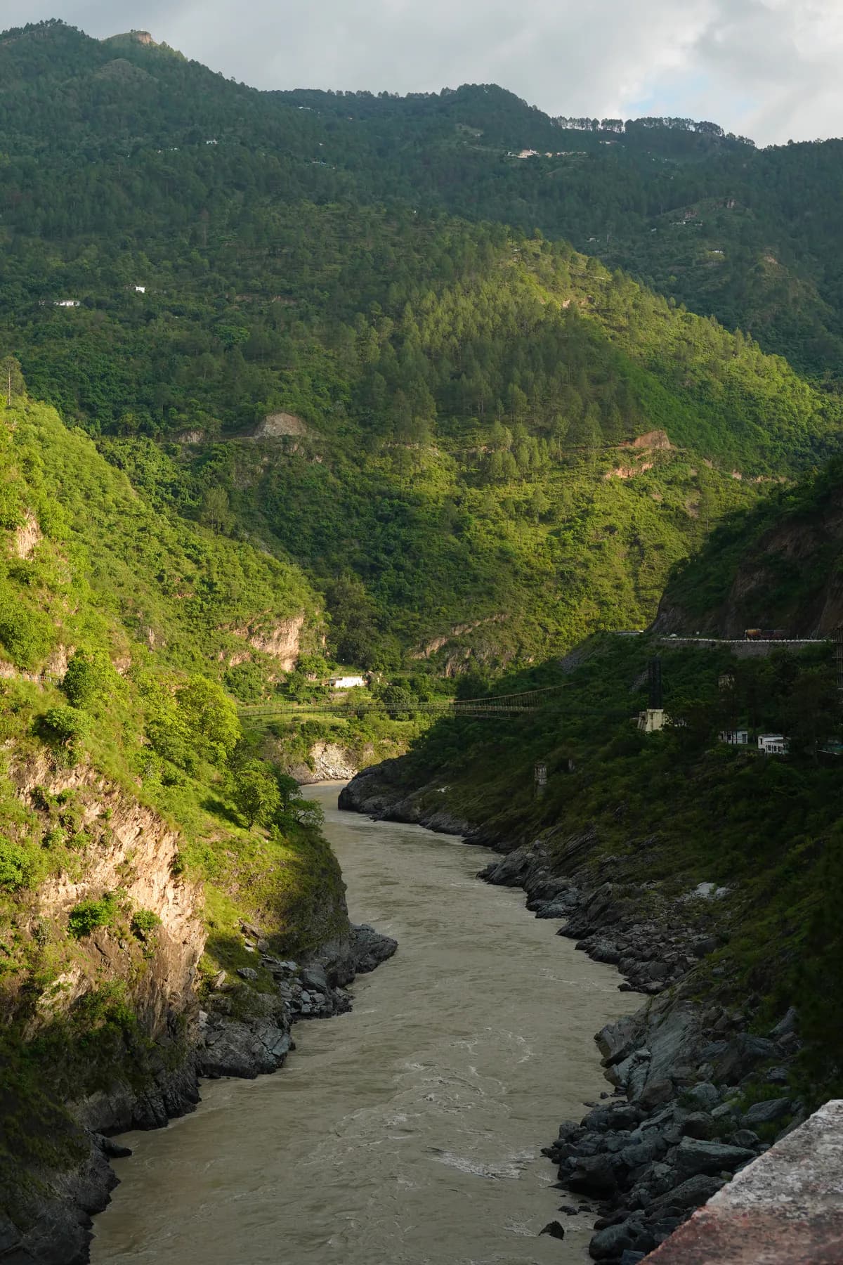 River and green mountain valley on the road journey through Uttarakhand